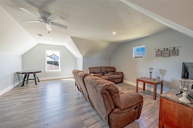 living room with vaulted ceiling, ceiling fan, and hardwood / wood-style floors