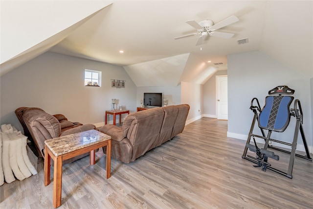 living room with light hardwood / wood-style floors, lofted ceiling, and ceiling fan