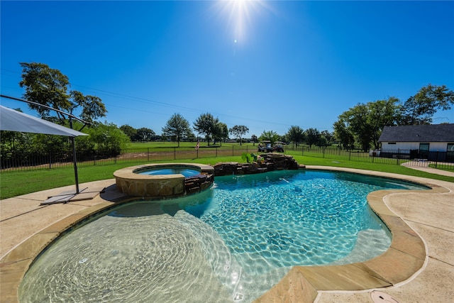 view of pool featuring a yard and an in ground hot tub