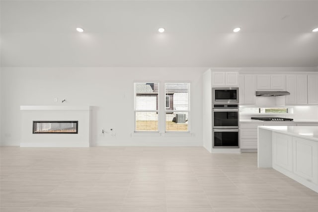 kitchen with white cabinetry and appliances with stainless steel finishes