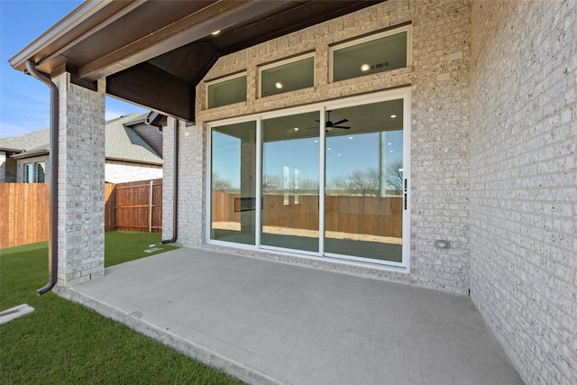 view of patio featuring ceiling fan