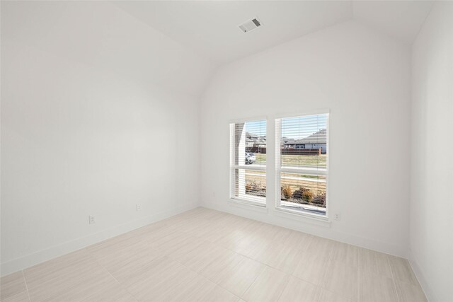 dining space with lofted ceiling, light hardwood / wood-style floors, a chandelier, and plenty of natural light