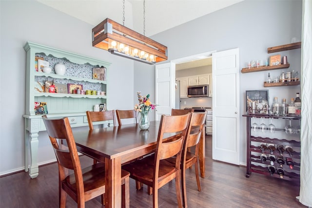 dining space featuring dark wood-type flooring