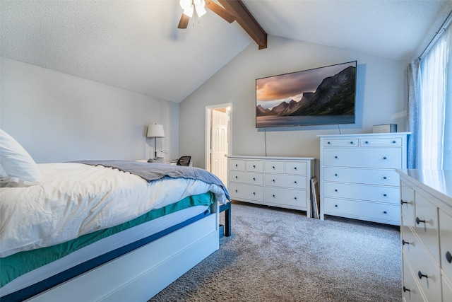 carpeted bedroom featuring a textured ceiling, ceiling fan, and lofted ceiling with beams