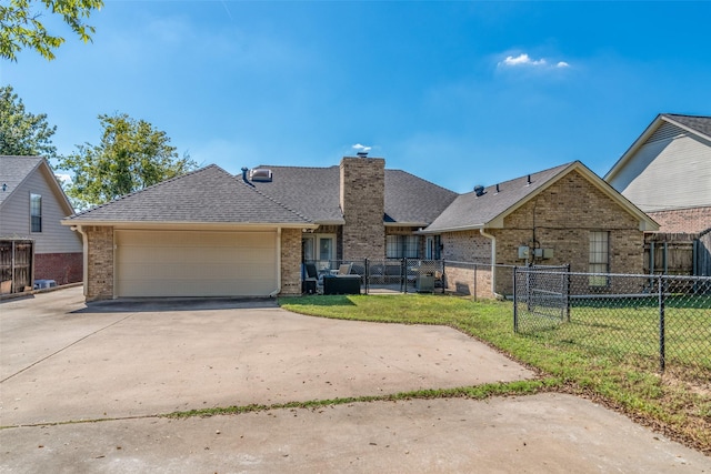 view of front of house with a front lawn and a garage