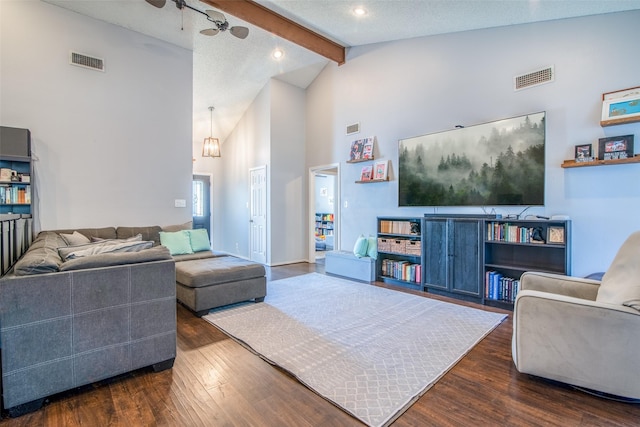 living room with beam ceiling, dark hardwood / wood-style floors, a textured ceiling, and high vaulted ceiling