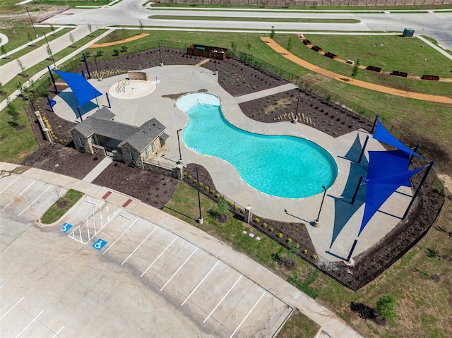 view of swimming pool with fence