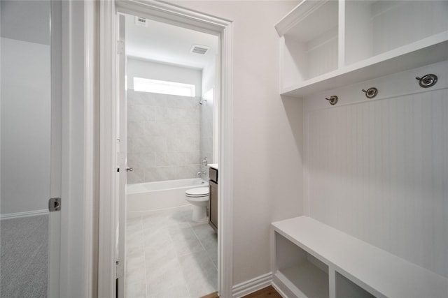 mudroom with tile patterned flooring, visible vents, and baseboards