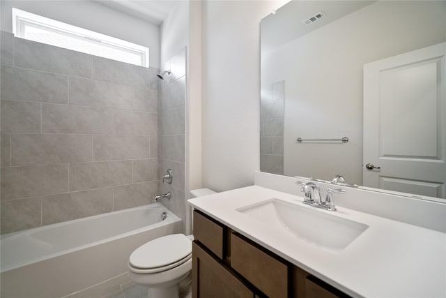 full bath with washtub / shower combination, visible vents, vanity, and toilet