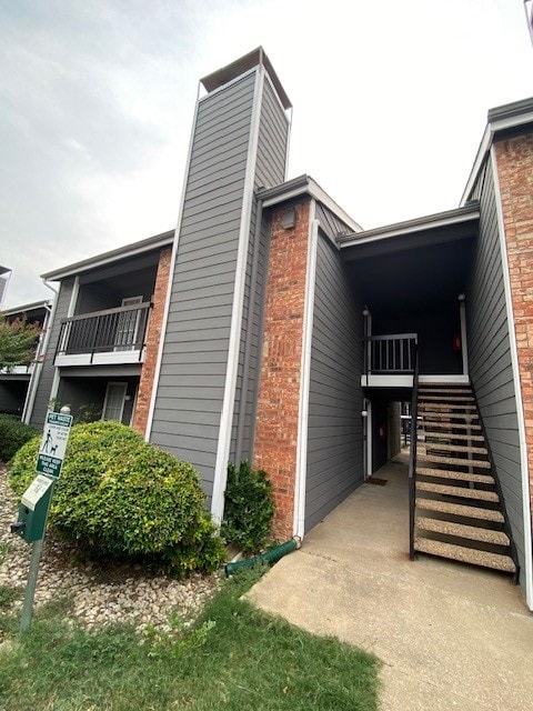 view of home's exterior with a balcony