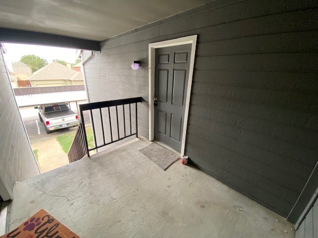 entrance to property featuring a carport