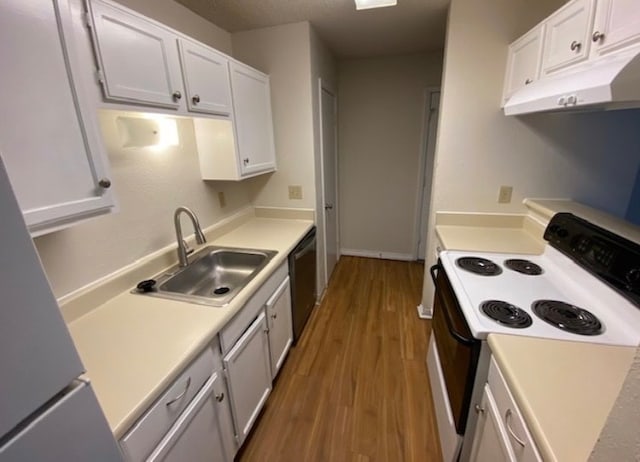 kitchen featuring wood-type flooring, white range with electric cooktop, sink, and white cabinetry