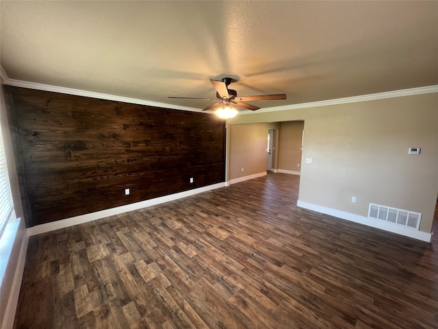 spare room featuring ornamental molding, ceiling fan, and dark hardwood / wood-style flooring