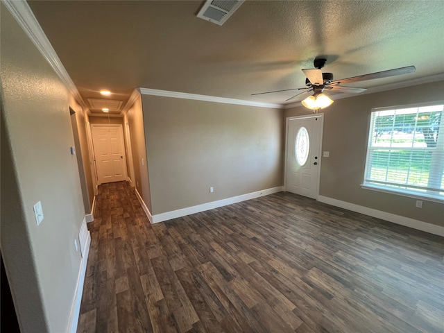 foyer featuring a textured ceiling, ornamental molding, dark hardwood / wood-style flooring, and ceiling fan