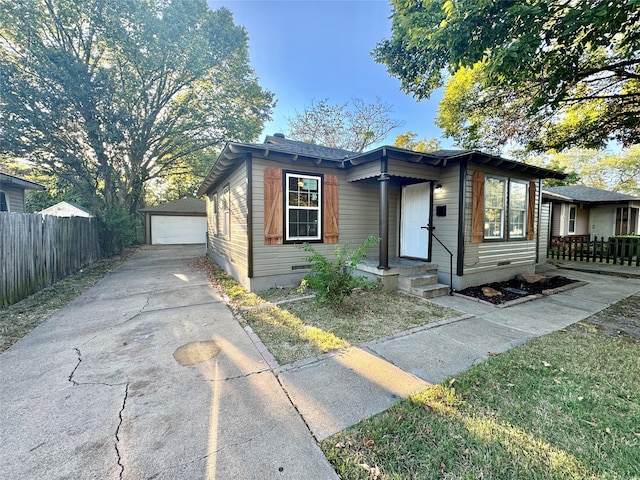 view of front of home with an outbuilding and a garage