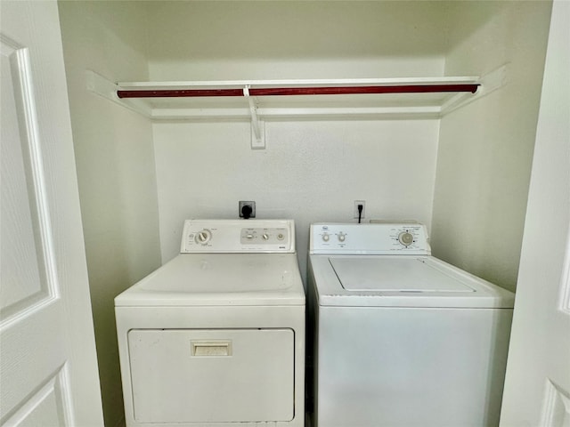 laundry room featuring washing machine and dryer