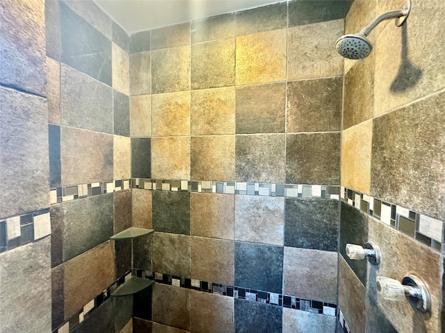 bathroom featuring tile walls and tiled shower