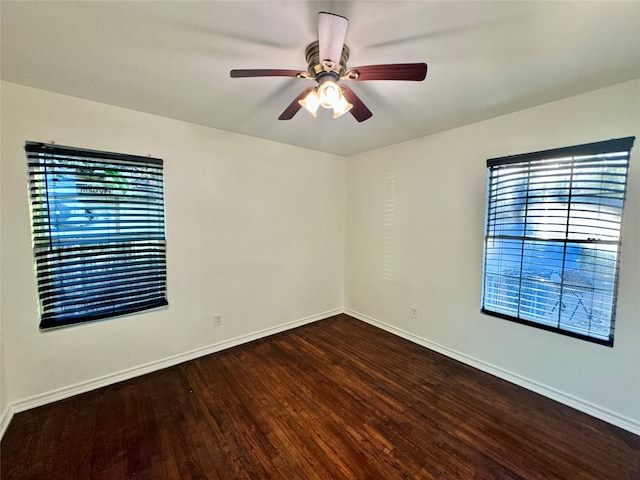 unfurnished room featuring dark hardwood / wood-style floors and ceiling fan