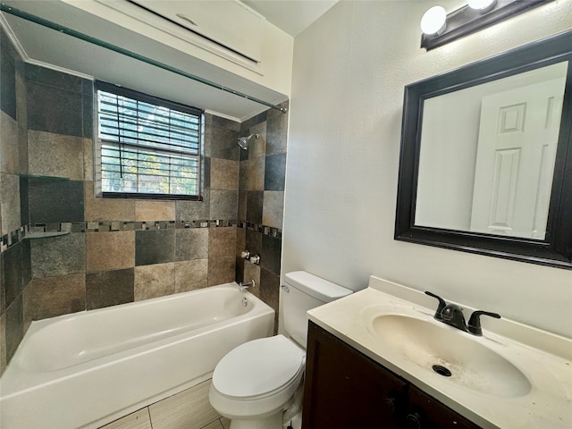 full bathroom with tiled shower / bath, vanity, and toilet