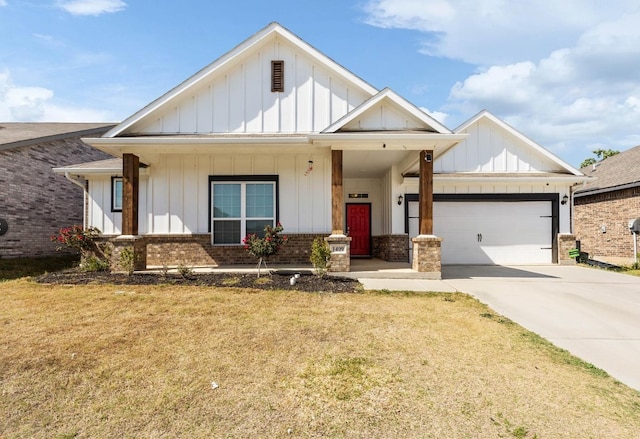 view of front facade with a front lawn, a porch, and a garage