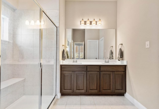 bathroom with vanity, an enclosed shower, and tile patterned floors