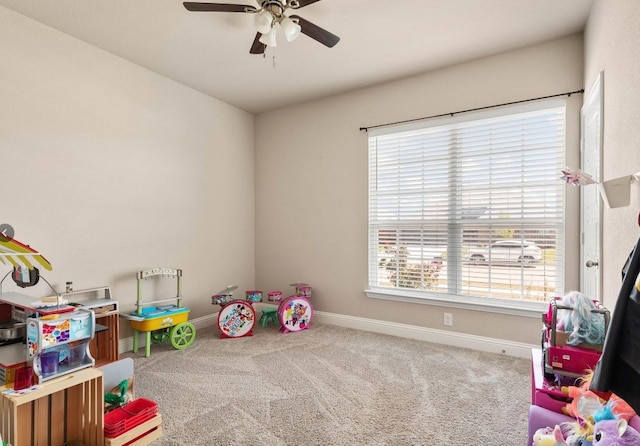 recreation room featuring carpet floors and ceiling fan