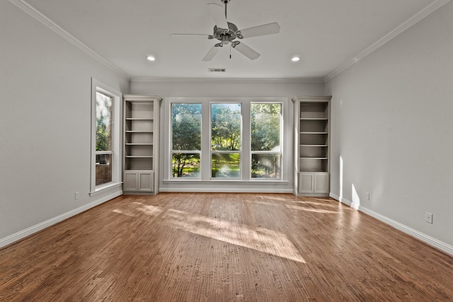 spare room with ceiling fan, hardwood / wood-style floors, and ornamental molding