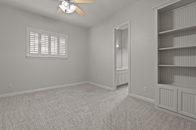 carpeted empty room with ceiling fan