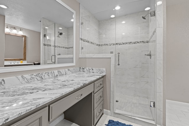 bathroom with vanity, tile patterned floors, and an enclosed shower