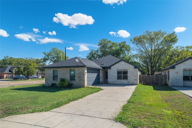 view of front of property featuring a garage and a front lawn