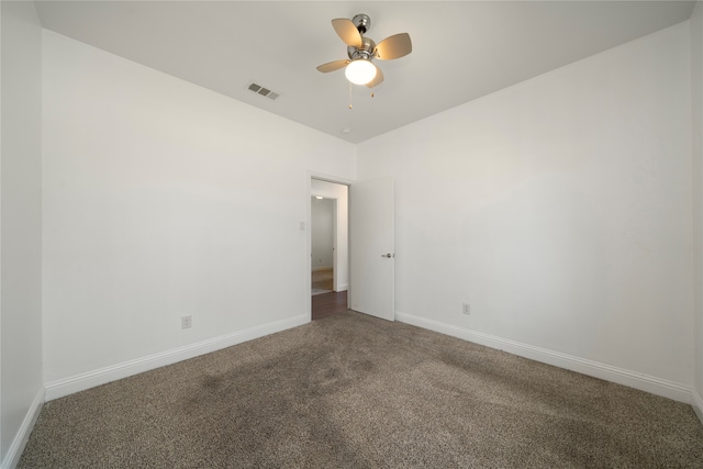 carpeted empty room featuring ceiling fan