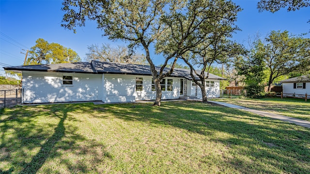 view of front of property with a front lawn