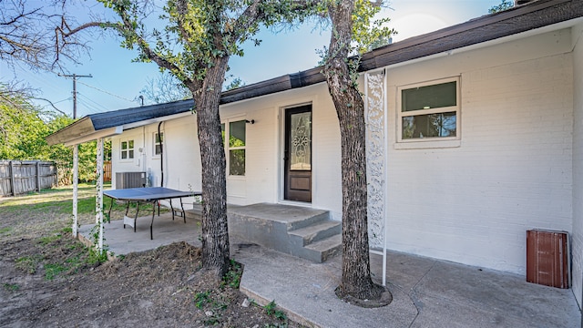 property entrance with a patio area