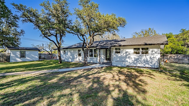 exterior space featuring a lawn and an outdoor structure