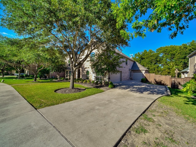 view of front facade with a front lawn and a garage