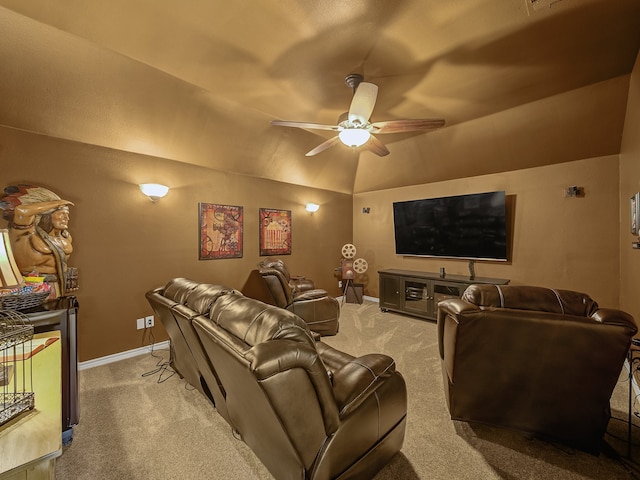 home theater featuring light carpet, vaulted ceiling, and ceiling fan