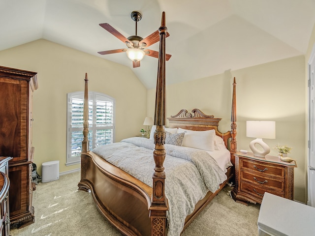 bedroom featuring vaulted ceiling, light carpet, and ceiling fan