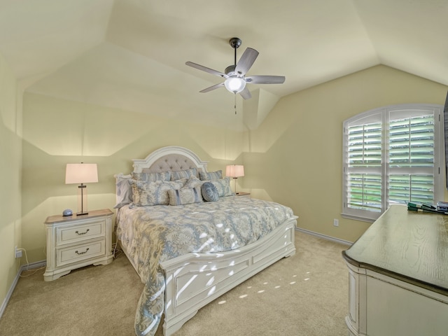 carpeted bedroom featuring lofted ceiling and ceiling fan