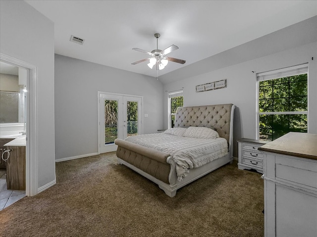 bedroom with dark carpet, ceiling fan, multiple windows, and access to outside