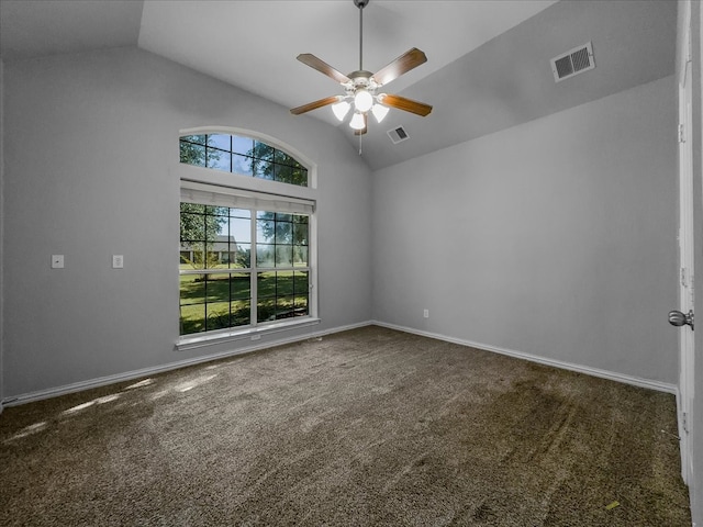 carpeted spare room featuring lofted ceiling and ceiling fan