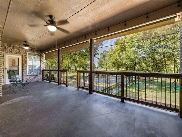 exterior space with ceiling fan