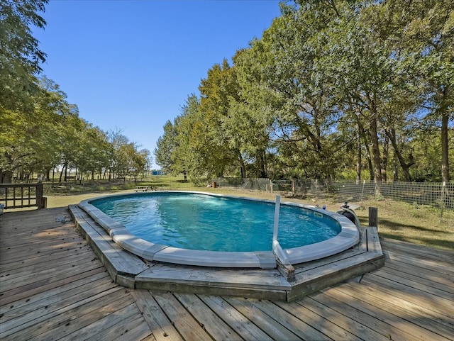 view of pool with a wooden deck