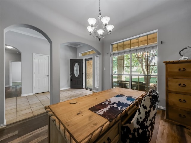 interior space featuring an inviting chandelier and hardwood / wood-style floors