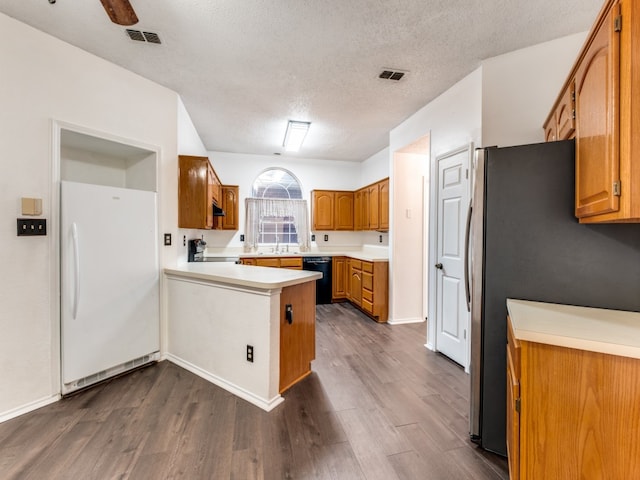 kitchen with stainless steel fridge, white refrigerator, black dishwasher, ceiling fan, and dark hardwood / wood-style floors