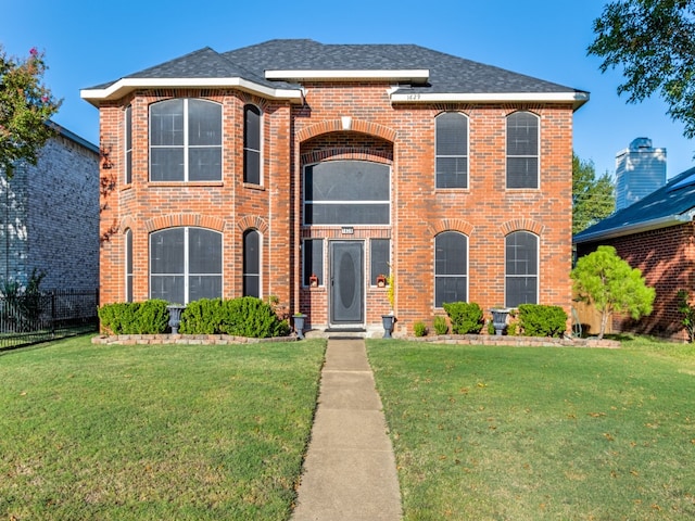 view of front of property with a front lawn