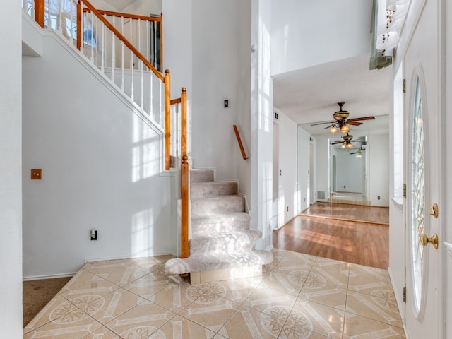 entrance foyer with ceiling fan and light hardwood / wood-style floors