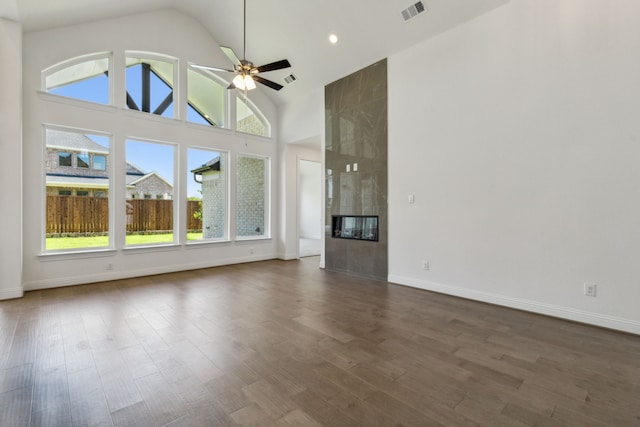 603 Mountain Laurel Rd, Wylie, TX 75098 - unfurnished living room with high vaulted ceiling, dark wood finished floors, a ceiling fan, baseboards, and visible vents