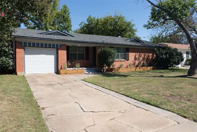 ranch-style home with a garage and a front lawn