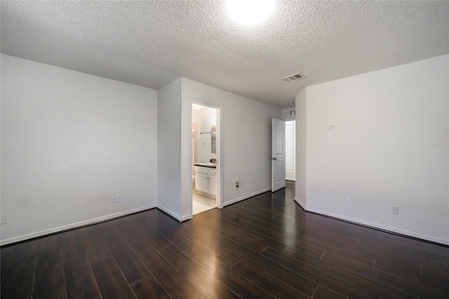 spare room with a textured ceiling