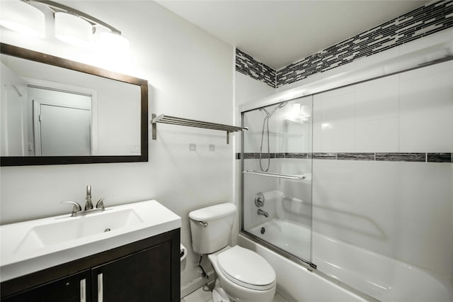 full bathroom with toilet, enclosed tub / shower combo, and vanity